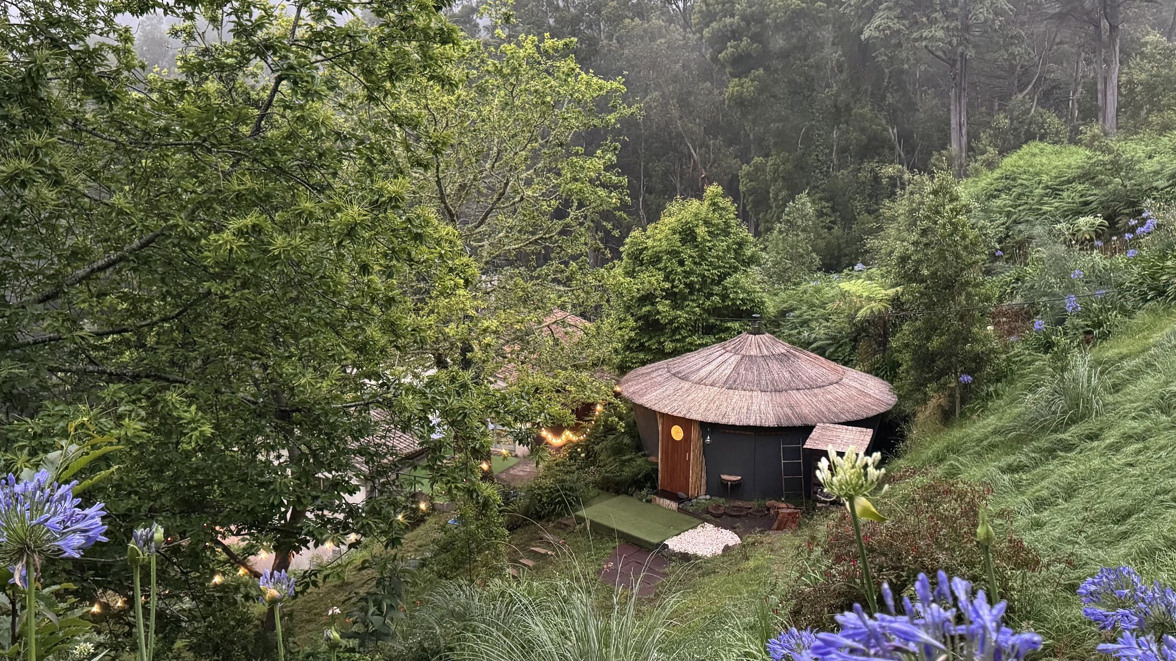 The Spiral banya among agapanthus and misty eucalyptus